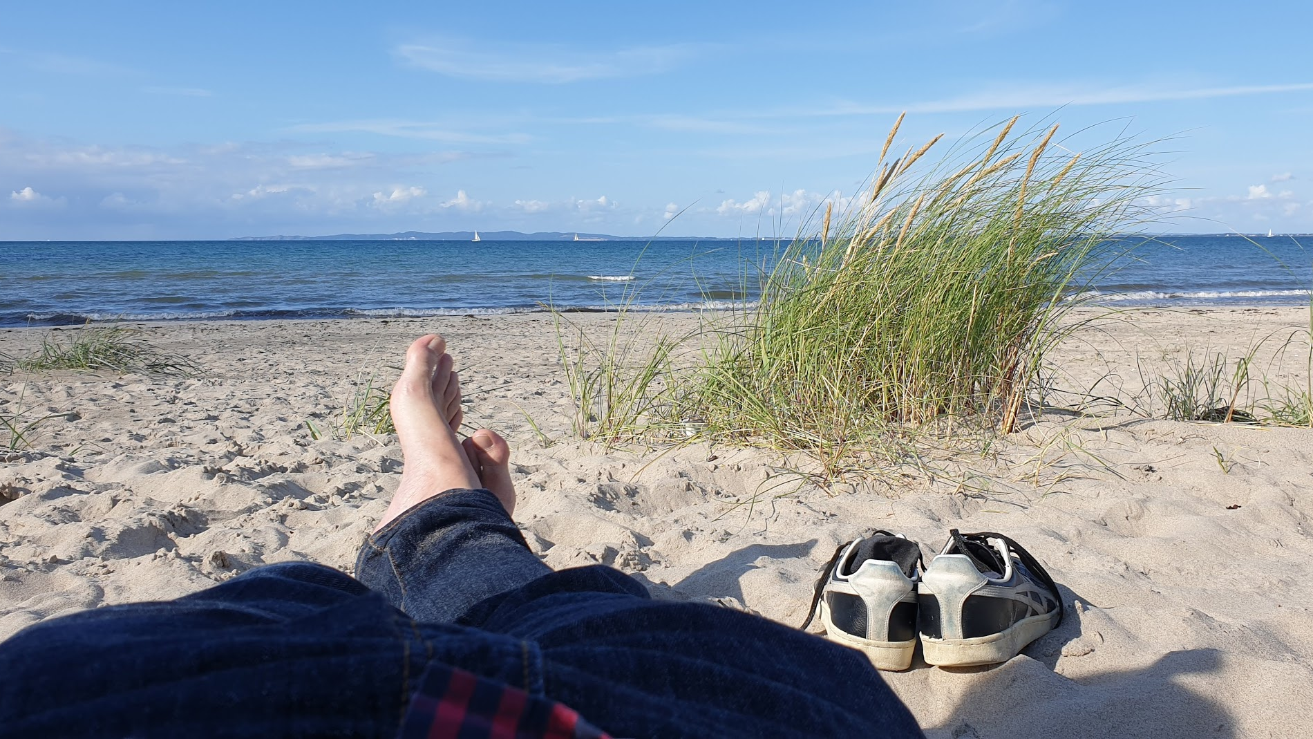 Sitting on the beach to show how relaxing Denmark can be