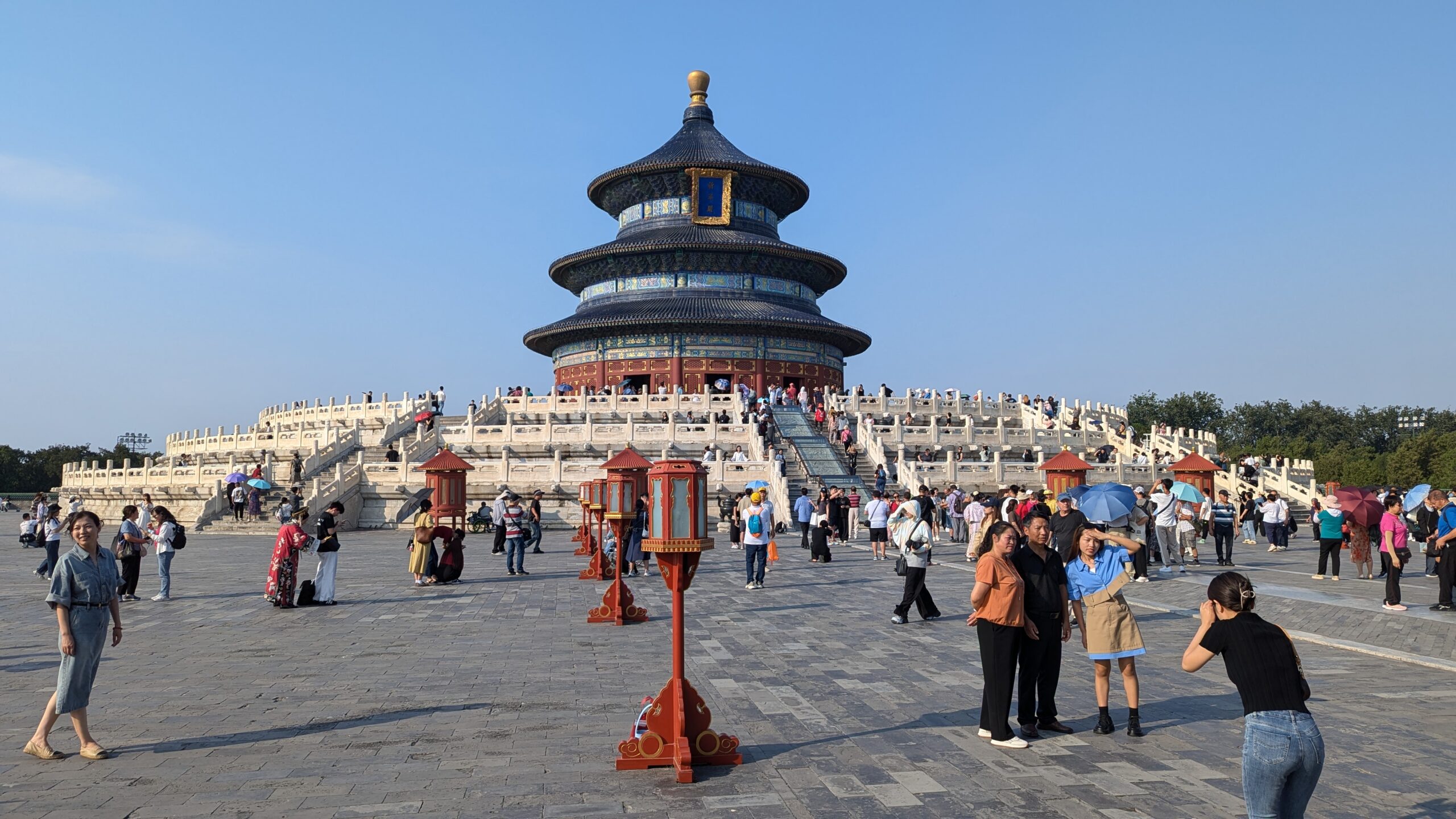 The image shows a three-storey round temple in Beijing China, called the Temple of Heaven.